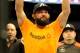 Johny Hendricks celebrates after beating Robbie Lawler during a UFC 171 mixed martial arts welterweight title bout, Saturday, March 15, 2014, in Dallas. Hendricks won by decision. (AP Photo/Matt Strasen)