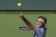 Roger Federer, of Switzerland, serves to Novak Djokovic, of Serbia, in the final match of the BNP Paribas Open tennis tournament, Sunday, March 16, 2014, in Indian Wells, Calif. (AP Photo/Mark J. Terrill)