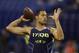 Virginia Tech quarterback Logan Thomas throws during a drill at the NFL football scouting combine in Indianapolis, Sunday, Feb. 23, 2014. (AP Photo/Michael Conroy)