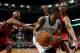 Mar 19, 2014; Boston, MA, USA; Boston Celtics point guard Rajon Rondo (9) holds the ball as Miami Heat shooting guard Ray Allen (34) and guard/forward Shane Battier (31) defend during the fourth quarter at TD Garden. The Celtics won 101-96. Mandatory Credit: Greg M. Cooper-USA TODAY Sports