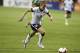 United States' midfielder Heather O'Reilly prepares to kick the ball during the first half of an international friendly soccer match against Mexico at RFK Stadium Tuesday, Sept. 3, 2013, in Washington. (AP Photo/Alex Brandon)