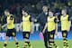 Dortmund head coach Juergen Klopp, center, and his players walk on the pitch after the Champions League round of 16 second leg soccer match between Borussia Dortmund and FC Zenit in Dortmund, Germany, Wednesday, March19,2014. (AP Photo/Frank Augstein)