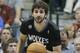 Minnesota Timberwolves guard Ricky Rubio (9) of Spain dribbles the ball during the first half an NBA basketball game against the Dallas Mavericks Wednesday, March 19, 2014, in Dallas. (AP Photo/LM Otero)