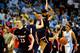 CHAPEL HILL, NC - NOVEMBER 17: Craig Bradshaw #23 of the Belmont Bruins and teammates celebrate after a win as Marcus Paige #5 of the North Carolina Tar Heels walks off the court at the Dean Smith Center on November 17, 2013 in Chapel Hill, North Carolina. Belmont defeated North Carolina 83-80. (Photo by Grant Halverson/Getty Images)