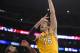 Los Angeles Lakers center Pau Gasol, right, of Spain, puts up a shot as San Antonio Spurs guard Marco Belinelli, of Italy, defends during the second half of their NBA basketball game, Wednesday, March 19, 2014, in Los Angeles. The Spurs won 125-109. (AP Photo/Mark J. Terrill)