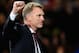 MANCHESTER, ENGLAND - MARCH 19: Manchester United Manager David Moyes celebrates at the end of the UEFA Champions League Round of 16 second round match between Manchester United and Olympiacos FC at Old Trafford on March 19, 2014 in Manchester, England. (Photo by Laurence Griffiths/Getty Images)