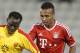Bayern Munich's Julian Green, right, of Munich and Balla Jabir of Al-Merrikh, challenge for the ball, during their friendly soccer match, at Al-Saad stadium in Doha Thursday, Jan. 9, 2014. (AP Photo/Osama Faisal)