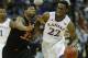 Kansas guard Andrew Wiggins (22) is covered by Oklahoma State guard Marcus Smart (33) during the second half of an NCAA college basketball game in the quarterfinals of the Big 12 Conference men's tournament in Kansas City, Mo., Thursday, March 13, 2014. Kansas defeated Oklahoma State 77-70 in overtime. (AP Photo/Orlin Wagner)