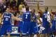 FILE - In this Nov. 22, 2011, file photo, Memphis' Preston Laird (31), Antonio Barton (2), Trey Draper, right center, and Stan Simpson (32) celebrate their double overtime win in a NCAA college basketball game against Tennessee, in Lahaina, Hawaii. A person familiar with the talks says the Big East is in discussions with Memphis about the Tigers joining the conference in all sports. The person spoke on the condition of anonymity Tuesday, Feb. 7, 2012, because talks were ongoing between Memphis and the Big East. (AP Photo/Eugene Tanner, File)