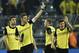 Dortmund's scorer Sebastian Kehl, second left, shows the victory sign after the UEFA Champions League last 16 second leg soccer match between Borussia Dortmund and FC Zenit in Dortmund, Germany, Wednesday, March 19, 2014. Zenit defeated Dortmund by 2-1. (AP Photo/Martin Meissner)