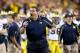 Michigan coach Brady Hoke yells at officials during the first half of the Buffalo Wild Wings Bowl NCAA college football game against Kansas State on Saturday, Dec. 28, 2013, in Tempe, Ariz. (AP Photo/Ross D. Franklin)