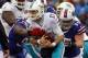 Dolphins QB Ryan Tannehill (middle) was sacked 58 times in 2013. The Dolphins would prefer it if he doesn't have to endure the same beating again.