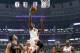 Chicago Bulls small forward Luol Deng (9) drives to the basket past Toronto Raptors point guard Greivis Vasquez, left, as Bulls' Jimmy Butler (21) and Raptors Terrence Ross stand near during the first half of an NBA basketball game Tuesday, Dec. 31, 2013, in Chicago. (AP Photo/Charles Rex Arbogast)