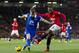 Manchester United's Patrice Evra, right, fights for the ball with Everton's Seamus Coleman during their English Premier League soccer match at Old Trafford Stadium, Manchester, England, Wednesday Dec. 4, 2013. (AP Photo/Jon Super)