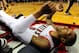 Mar 16, 2014; Portland, OR, USA; Portland Trail Blazers guard Damian Lillard (0) lays on the court after missing a shot during the fourth quarter of the game against the Golden State Warriors at the Moda Center. The Warriors won the game 113-112. Mandatory Credit: Steve Dykes-USA TODAY Sports