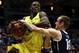 MILWAUKEE, WI - MARCH 20: Elgin Cook #23 of the Oregon Ducks is fouled by Josh Sharp #12 of the Brigham Young Cougars during the second round game of NCAA Basketball Tournament at BMO Harris Bradley Center on March 20, 2014 in Milwaukee, Wisconsin. (Photo by Jonathan Daniel/Getty Images)