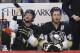 Pittsburgh Penguins' Brooks Orpik (44) and Paul Martin, left, sit on the bench during the third period of an NHL hockey game between the Pittsburgh Penguins and the Florida Panthers in Pittsburgh, Monday, Jan. 20, 2014. (AP Photo/Gene J. Puskar)