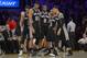 San Antonio Spurs, from left, Marco Belinelli, of Italy, Tim Duncan, Kawhi Leonard, Patty Mills, of Australia, and Danny Green wait during a timeout in the second half of their NBA basketball game, Wednesday, March 19, 2014, in Los Angeles. The Spurs won 125-109. (AP Photo/Mark J. Terrill)