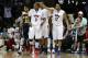 SMU guard Sterling Brown (3) celebrates with teammates forward Ben Moore (34) and guard Nick Russell (12) as UC Irvine guard Aaron Wright (32) walks away with during the second half of an NCAA college basketball game in the first round of the NIT Wednesday, March 19, 2014, in Dallas. SMU won 68-54. (AP Photo/Sharon Ellman)