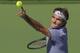 Roger Federer, of Switzerland, serves to Novak Djokovic, of Serbia, in the final match of the BNP Paribas Open tennis tournament, Sunday, March 16, 2014, in Indian Wells, Calif. (AP Photo/Mark J. Terrill)