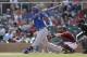 Kansas City Royals' Salvador Perez singles while batting against the Arizona Diamondbacks during the first inning of an exhibition spring training baseball game Wednesday, March 5, 2014, in Scottsdale, Ariz. (AP Photo/Gregory Bull)