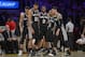 San Antonio Spurs, from left, Marco Belinelli, of Italy, Tim Duncan, Kawhi Leonard, Patty Mills, of Australia, and Danny Green wait during a timeout in the second half of their NBA basketball game, Wednesday, March 19, 2014, in Los Angeles. The Spurs won 125-109. (AP Photo/Mark J. Terrill)