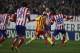 Barcelona's Lionel Messi from Argentina, center, controls the ball in between players during a Spanish La Liga soccer match between Atletico de Madrid and FC Barcelona at the Vicente Calderon stadium in Madrid, Spain, Saturday, Jan. 11, 2014. (AP Photo/Gabriel Pecot)