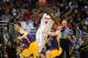 Mar 20, 2014; Orlando, FL, USA; Florida Gators center Patric Young (4) passes against Albany Great Danes forward Sam Rowley (14) during the second half of a men's college basketball game during the second round of the 2014 NCAA Tournament at Amway Center. Mandatory Credit: David Manning-USA TODAY Sports