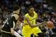 MILWAUKEE, WI - MARCH 20: Glenn Robinson III #1 of the Michigan Wolverines drives against Lee Skinner #34 of the Wofford Terriers in the second half during the second round of the 2014 NCAA Men's Basketball Tournament at BMO Harris Bradley Center on March 20, 2014 in Milwaukee, Wisconsin. (Photo by Mike McGinnis/Getty Images)