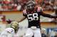 Virginia Tech linebacker Jack Tyler (58) pressures Pittsburgh quarterback Tom Savage (7) during the second half of an NCAA college football game in Blacksburg, Va., Saturday, Oct. 12, 2013. Virginia Tech won the game 19-9. (AP Photo/Steve Helber)