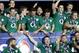 Ireland's rugby team players celebrate after defeating France and winning the Six Nations Rugby Union tournament at the stade de France stadium, in Saint Denis, outside Paris, Saturday, March 15, 2014. (AP Photo/Christophe Ena)