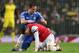 Arsenal's Mesut Ozil, right is lifted off the ball by Chelsea's Frank Lampard after the two clashed during their English Premier League soccer match between Arsenal and Chelsea at the Emirates stadium in London, Monday, Dec. 23, 2013. (AP Photo/Alastair Grant)