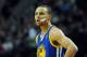 Mar 16, 2014; Portland, OR, USA; Golden State Warriors guard Stephen Curry (30) looks on as a Portland Trail Blazer shoots a free throw during the fourth quarter of the game at the Moda Center. The Warriors won the game 113-112. Mandatory Credit: Steve Dykes-USA TODAY Sports