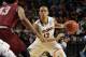 Connecticut guard Shabazz Napier (13) drives against Saint Joseph's forward DeAndre Bembry (43) during the first half of a second-round game in the NCAA college basketball tournament in Buffalo, N.Y., Thursday, March 20, 2014. (AP Photo/Bill Wippert)