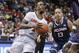 Louisville guard Russ Smith (2) drives past Connecticut guard Shabazz Napier (13) during the first half of an NCAA college basketball game in the finals of the American Athletic Conference men's tournament Saturday, March 15, 2014, in Memphis, Tenn. (AP Photo/Mark Humphrey)