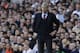 Arsenal's manager Arsene Wenger watches his team play from the technical area during the English Premier League soccer match between Tottenham Hotspur and Arsenal at White Hart Lane stadium in London, Sunday, March 16, 2014. (AP Photo/Matt Dunham)