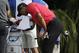 Tiger Woods wipes his face before teeing off on the 12th hole during the final round of the Cadillac Championship golf tournament Sunday, March 9, 2014, in Doral, Fla. (AP Photo/Lynne Sladky)