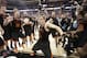 Mercer guard Kevin Canevari (3) dances with team mates after the second half of an NCAA college basketball second-round game against Duke, Friday, March 21, 2014, in Raleigh, N.C. Mercer won 78-71. (AP Photo/Chuck Burton)