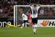 Tottenham's Sandro, foreground, from Brazil, reacts after Benfica's goalkeeper Jan Oblak, background on the pitch, from Slovenia, makes a save during the Europa League, round of 16, second leg soccer match between Benfica and Tottenham at Benfica's Luz stadium, in Lisbon, Thursday, March 20, 2014. Benfica won 5-3 on aggregate and advances to the next round. (AP Photo/Francisco Seco)