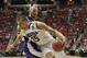 Arizona center Kaleb Tarczewski spins around Weber State center Kyle Tresnak while going to the basket during the first half in a second-round game in the NCAA college basketball tournament Friday, March 21, 2014, in San Diego. (AP Photo/Gregory Bull)
