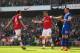 LONDON, ENGLAND - MARCH 08: Olivier Giroud of Arsenal celebrates with teammate Mesut Oezil after scoring his team's fourth goal during the FA Cup Quarter-Final match between Arsenal and Everton at Emirates Stadium on March 8, 2014 in London, England. (Photo by Paul Gilham/Getty Images)