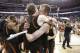 Mercer'sJakob Gollon, right, and Bud Thomas embrace after defeating Duke 78-71 in an NCAA college basketball second-round game against Duke, Friday, March 21, 2014, in Raleigh, N.C. (AP Photo/Chuck Burton)