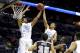 Mar 21, 2014; San Antonio, TX, USA; North Carolina Tar Heels forward James Michael McAdoo (43) pulls down a rebound over Providence Friars forward Tyler Harris (25) in the first half of a men's college basketball game during the second round of the 2014 NCAA Tournament at AT&T Center. Mandatory Credit: Kevin Jairaj-USA TODAY Sports