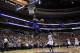 New York Knicks' Tim Hardaway Jr., center, goes up for a dunk as Philadelphia 76ers' James Anderson looks on during the first half of an NBA basketball game, Friday, March 21, 2014, in Philadelphia. (AP Photo/Matt Slocum)