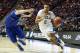 UCLA forward Kyle Anderson, right, drives with the ball as Tulsa forward Lew Evans defends during the first half of a second-round game in the NCAA men's college basketball tournament Friday, March 21, 2014, in San Diego. (AP Photo/Lenny Ignelzi)