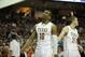 Feb 1, 2014; Austin, TX, USA; Texas Longhorns forwards Jonathan Holmes (10) and Connor Lammert (21) react against the Kansas Jayhawks during the second half at the Frank Erwin Special Events Center. Texas beat Kansas 81-69. Mandatory Credit: Brendan Maloney-USA TODAY Sports