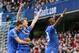 Chelsea's Andre Schuerrle, centre, celebrates after scoring his team's second goal of the game during their English Premier League soccer match between Chelsea and Arsenal at Stamford Bridge stadium in London Saturday, March 22 2014. (AP Photo/Alastair Grant)