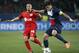 PSG's Thiago Silva, right, challenges with Leverkusen's Sidney Sam during the Champions League round of 16 second leg soccer match between Paris Saint Germain and Bayer Leverkusen at the Parc des Princes stadium in Paris, Wednesday, March 12, 2014. (AP Photo/Christophe Ena)