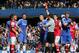 Referee Andre Marriner, in grey, sends off Arsenal's Kieran Gibbs, left, during their English Premier League soccer match between Chelsea and Arsenal at Stamford Bridge stadium in London Saturday, March 22 2014. (AP Photo/Alastair Grant)