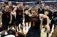 RALEIGH, NC - MARCH 21: Kevin Canevari #3 of the Mercer Bears celebrates with teammates after defeating the Duke Blue Devils 78-71 in the second round of the 2014 NCAA Men's Basketball Tournament at PNC Arena on March 21, 2014 in Raleigh, North Carolina. (Photo by Streeter Lecka/Getty Images)